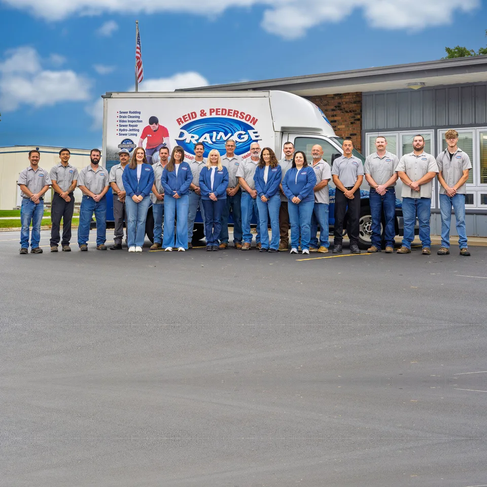 Reid & Pederson Drainage team in front of the company truck and office